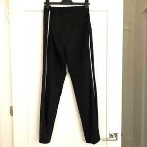 Black Sz 12 pants by Tracy Moore with white stripes down each size.